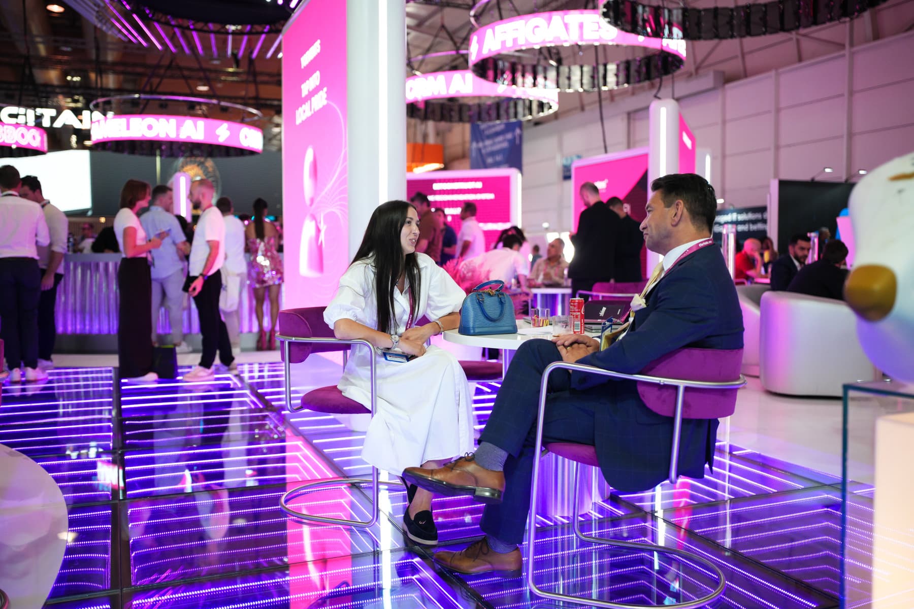Meetings on an iGaming industry expo floor